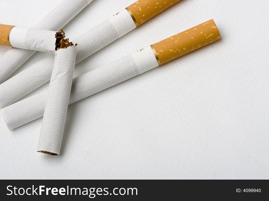 Four cigarets on white backgrounds