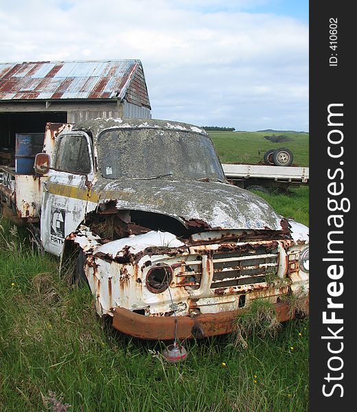 rusted carwreck on farmland in Northland ,New Zealand. rusted carwreck on farmland in Northland ,New Zealand