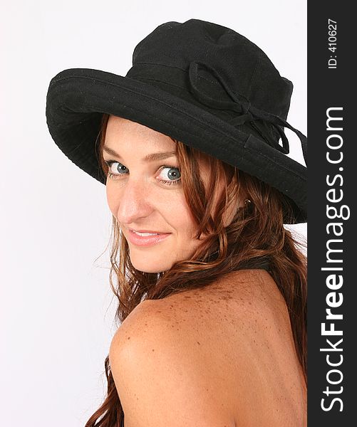 Model posing with her hat on. Model posing with her hat on