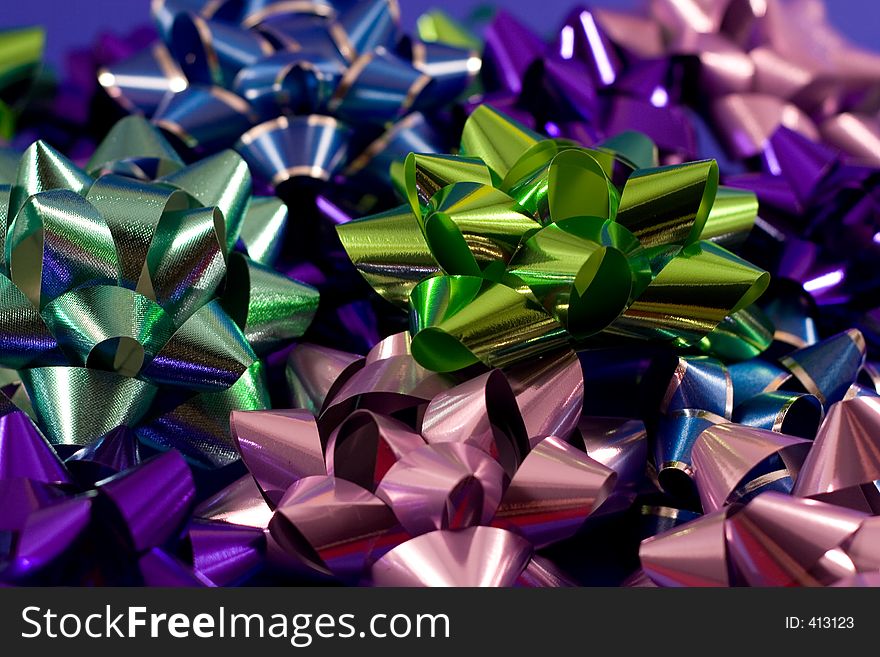 Various gift bows against a blue backdrop.