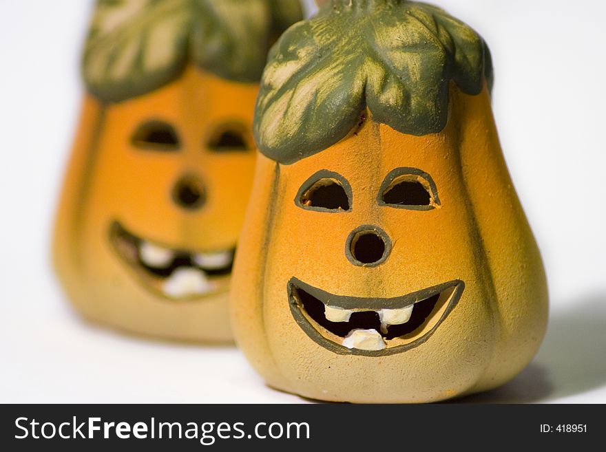 Smiley Ceramic Jack-O-Lantern Pumpkins against a white background