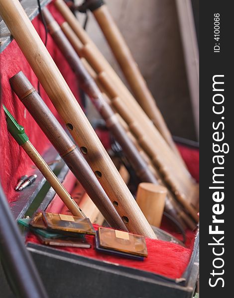 Interesting perspective on a suitcase containing specific wooden Ecuador's musical instruments.Shot with Canon 70-200mm f/2.8L IS USM. Interesting perspective on a suitcase containing specific wooden Ecuador's musical instruments.Shot with Canon 70-200mm f/2.8L IS USM