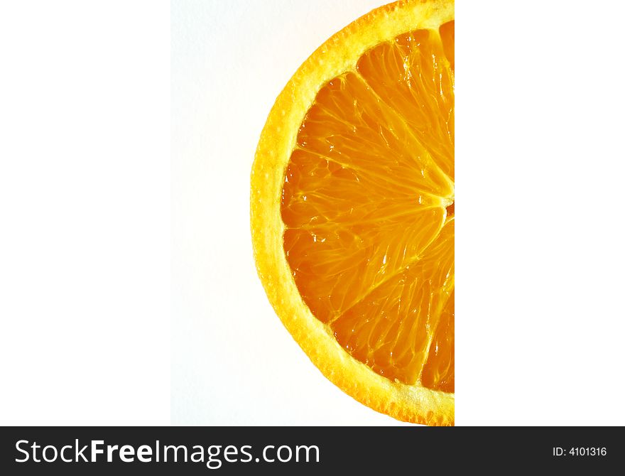 A closeup shot of an orange slice on white background. A closeup shot of an orange slice on white background.
