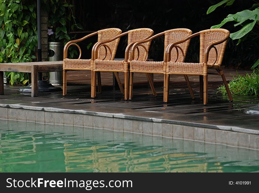 Rattan Chair At The Pool Side