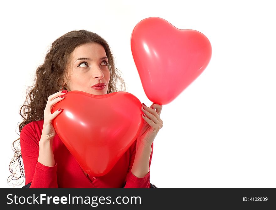 Attractive young woman holding heart shape balloons. Attractive young woman holding heart shape balloons