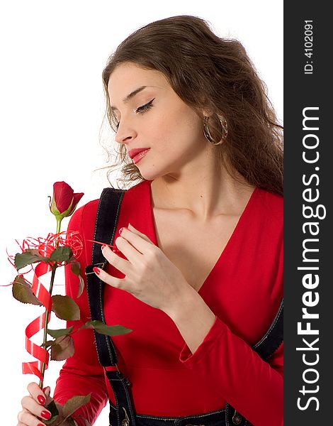 Attractive young woman in red holding red rose - love/valentine concept. Attractive young woman in red holding red rose - love/valentine concept