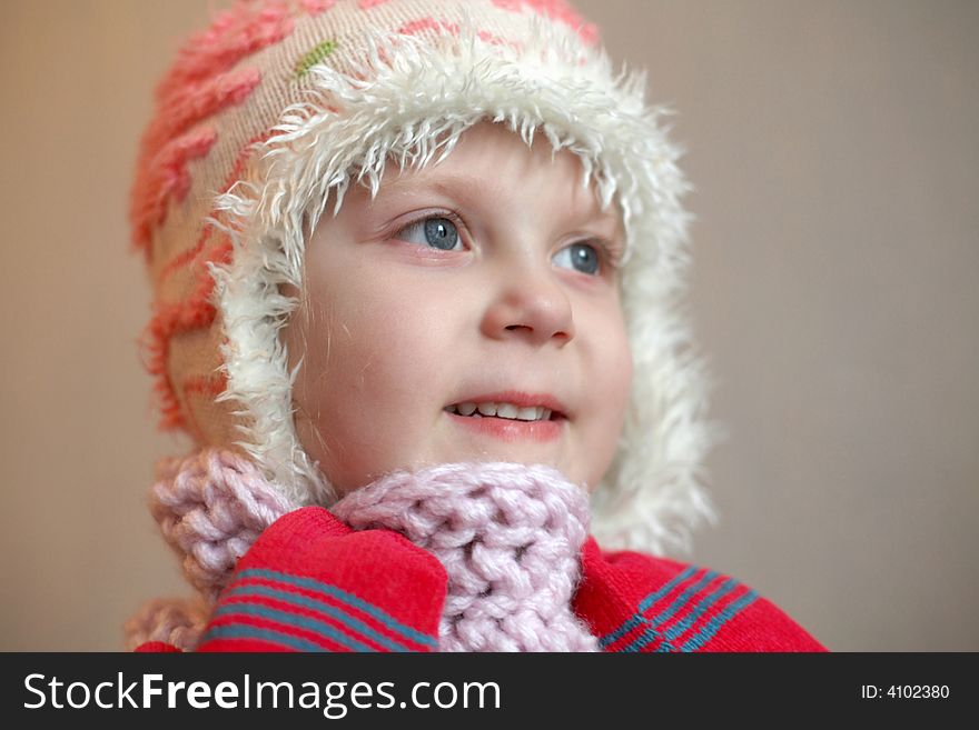 An image of a girl in red mittens
