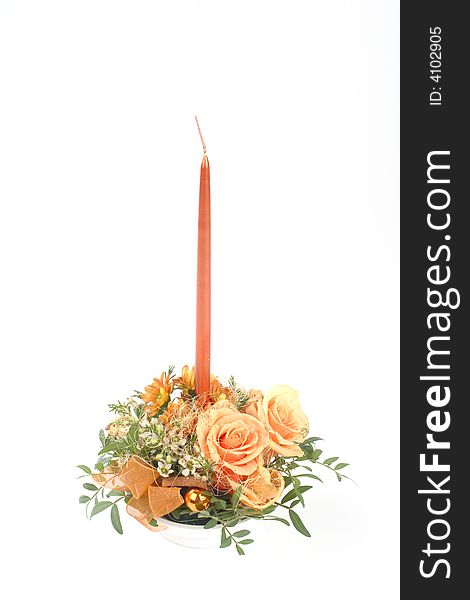 Candlestick with fresh orange roses. Candlestick with fresh orange roses