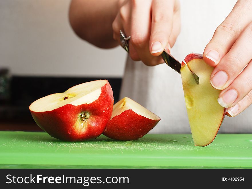 Apple on the counter symbolizes healthy living and nutritional value. Apple on the counter symbolizes healthy living and nutritional value