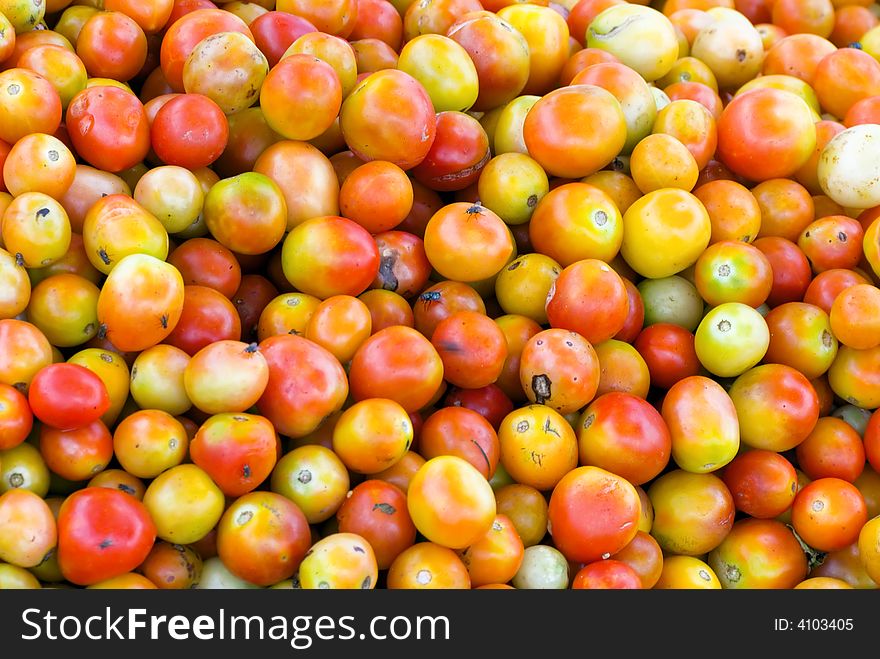 Red and green tomatoes at marketplace