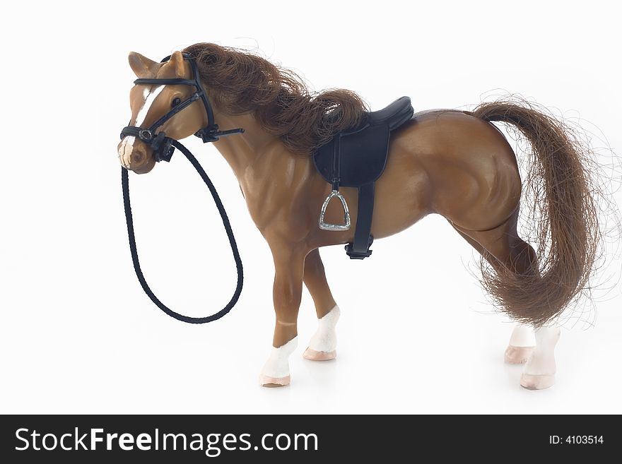 Plastic brown toy horse isolated on white background