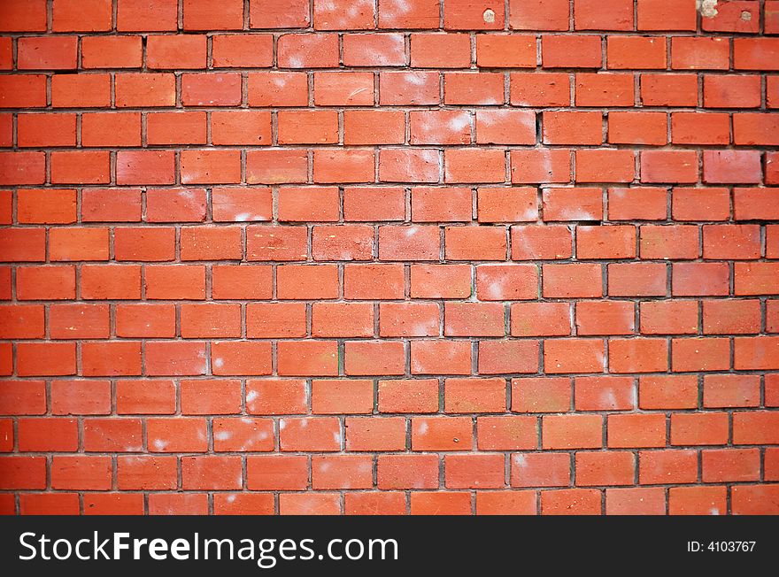 A dirty wall with red bricks. A dirty wall with red bricks