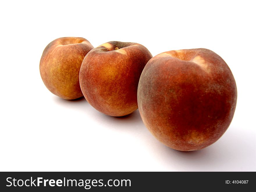 Three delicious peaches viewed diagonally