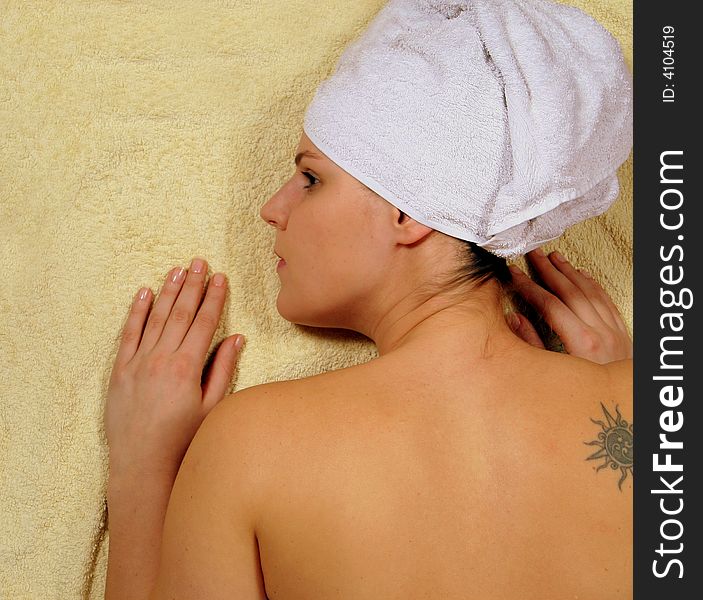 A young woman is enjoying her day in the spa. A young woman is enjoying her day in the spa.