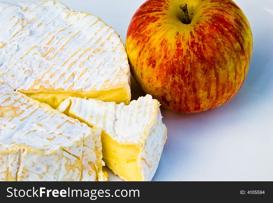 Fopod picture of sliced cheese with shiny apple. Fopod picture of sliced cheese with shiny apple