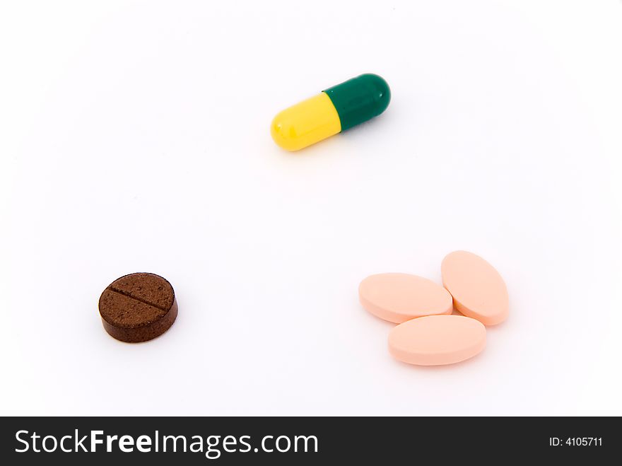 Five isolated pills triangle form. Five isolated pills triangle form