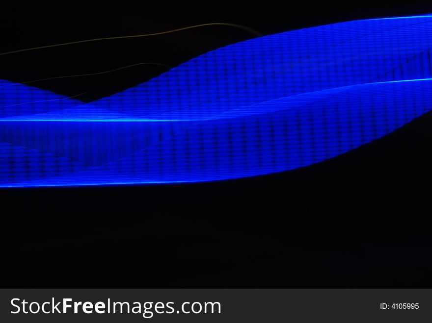 Abstract blue lighting effect flowing over black. Abstract blue lighting effect flowing over black.