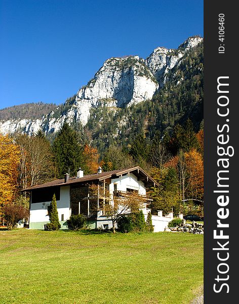 Nice small house near the Alps rock. Nice small house near the Alps rock