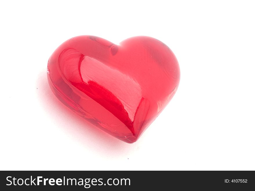 Close-up of a glass heart on a white background
