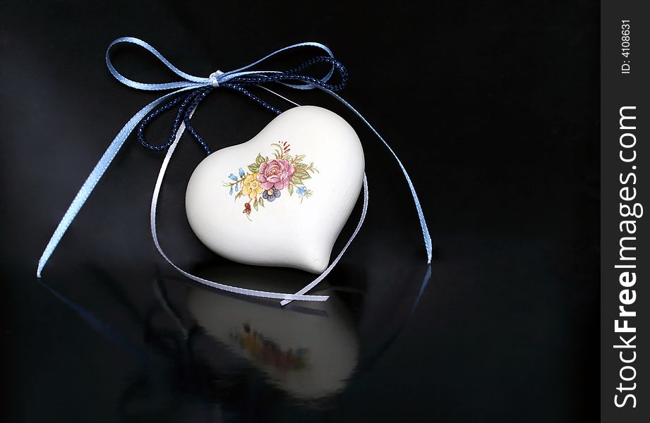 Valentine heart china ornament on dark background