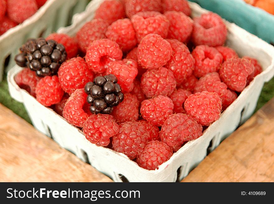 Farmers market fruit stand natural raspberries. Farmers market fruit stand natural raspberries