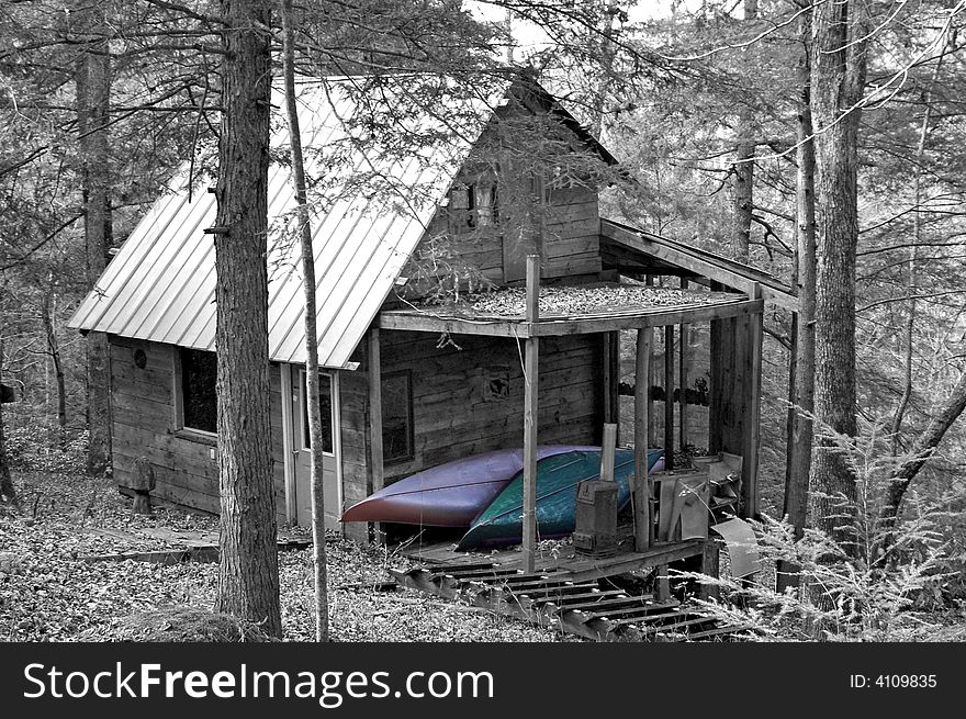 A shot of a old cabin along a creek. A shot of a old cabin along a creek.