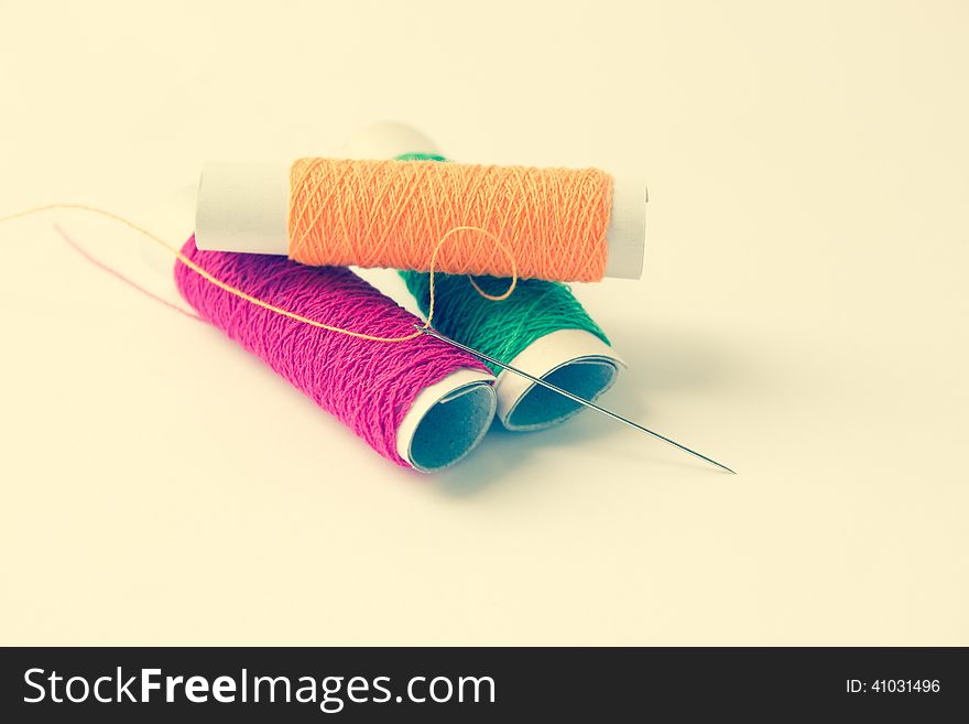 Sewing Threads And Needle Background