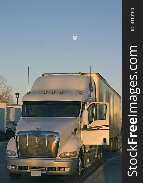 Truck parked under the moon -