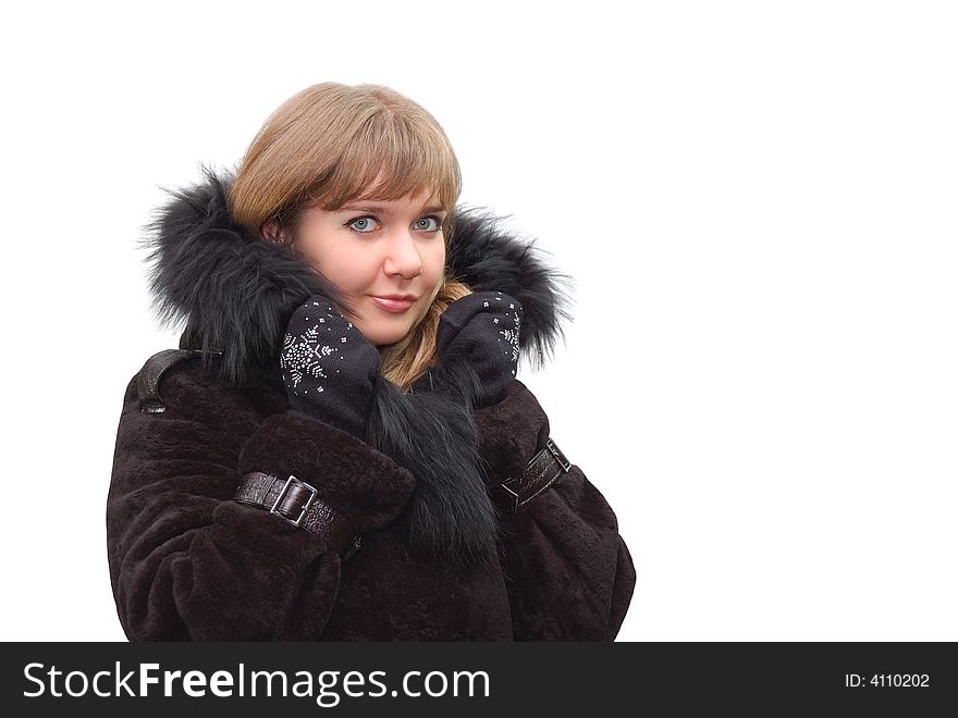 Beautiful girl in a fur coat isolated over a white background