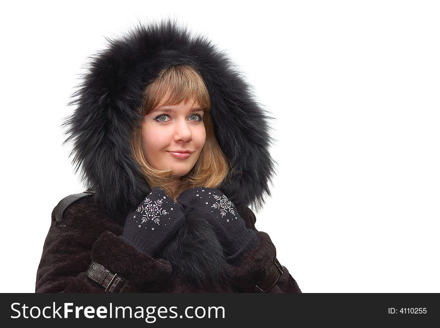 Beautiful girl in a fur coat with a hood isolated over a white background