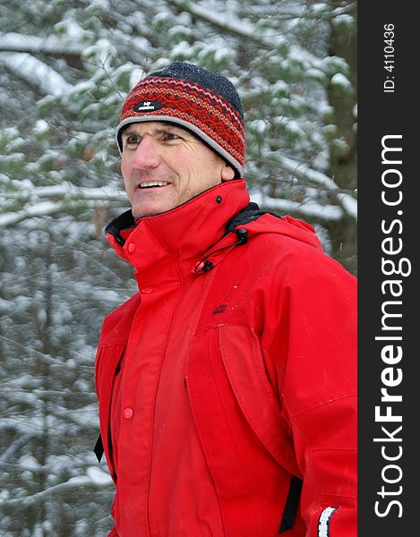 Outdoorsman enjoying the forest after a snowfall in Ontario. Outdoorsman enjoying the forest after a snowfall in Ontario