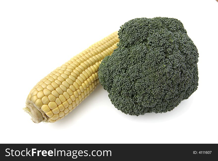 Cob corn with broccoli on a white background. Cob corn with broccoli on a white background