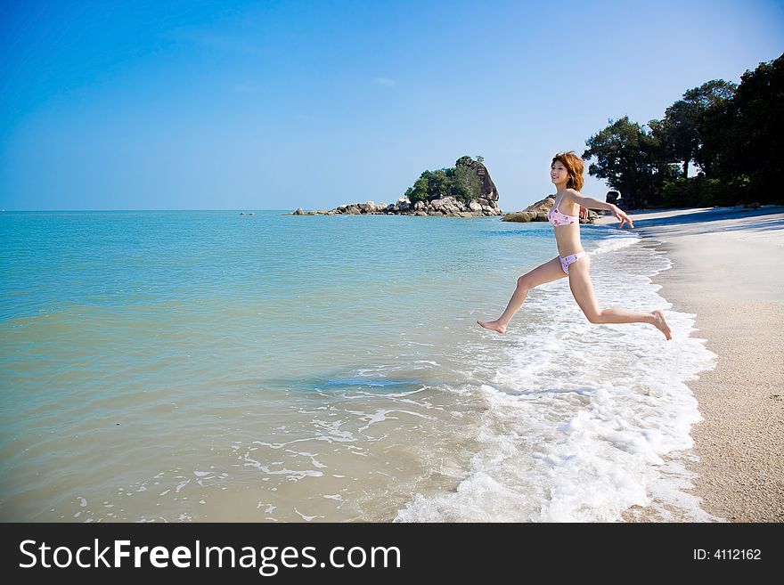 Young Woman Having Fun By The Sea