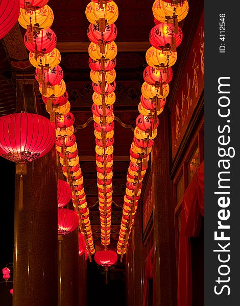 Lanterns in rows lighted up in front of corridor. Lanterns in rows lighted up in front of corridor