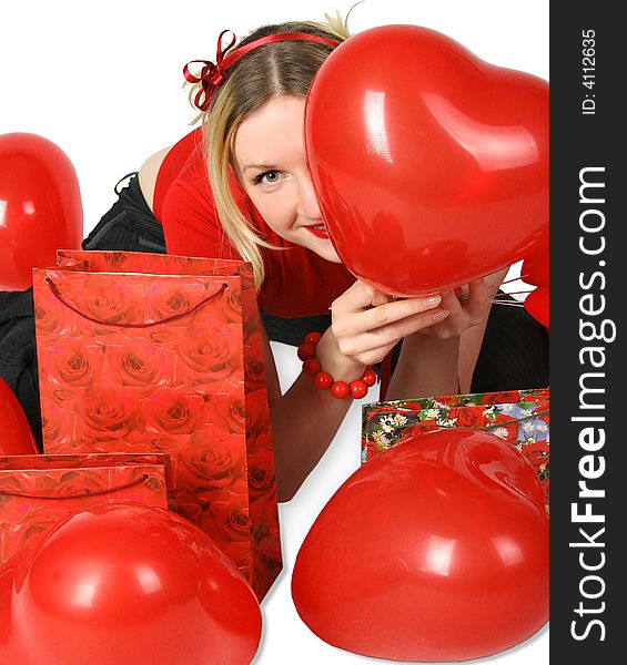 Beautiful blond girl with red hearts and gift boxes