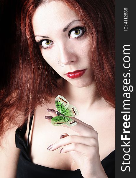 Beautiful girl with green butterfly