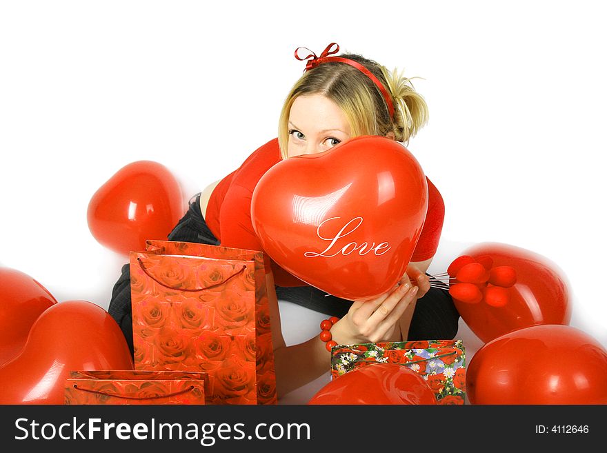 Beautiful blond girl with red hearts and gift boxes