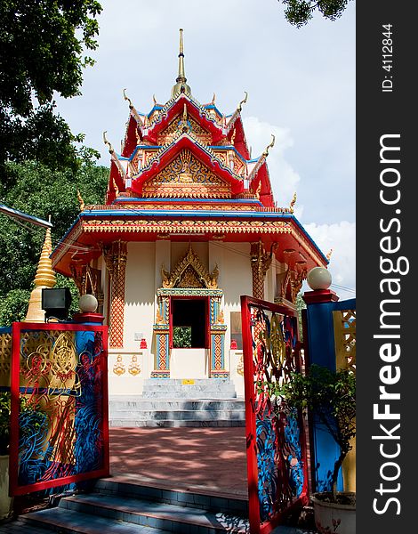 Colorful Buddhist Temple With Gate In Front