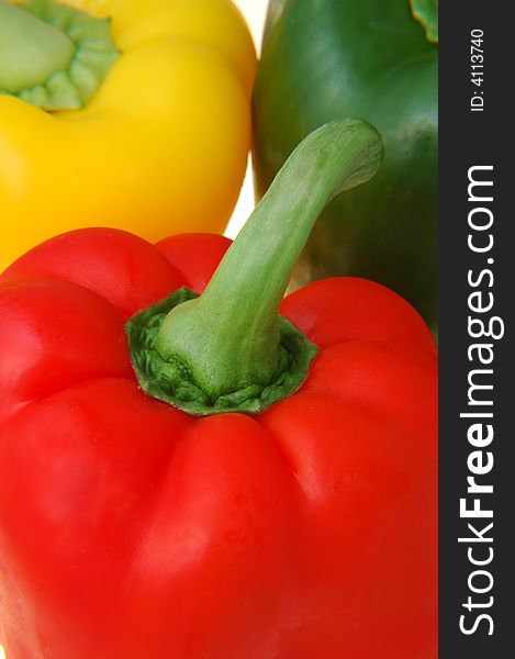 Fresh healthy red,green and yellow peppers closeup
