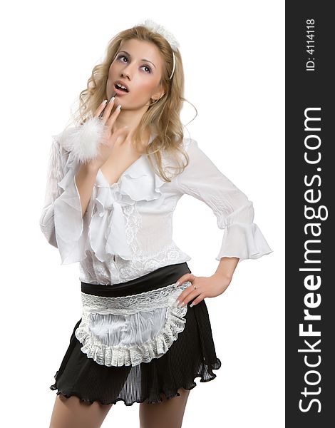 Pretty young parlormaid in a white shirt and a black skirt isolated on a white background. Pretty young parlormaid in a white shirt and a black skirt isolated on a white background