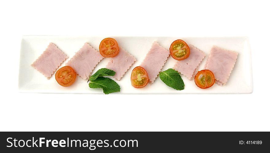 Rectangular dish with ham and tomato