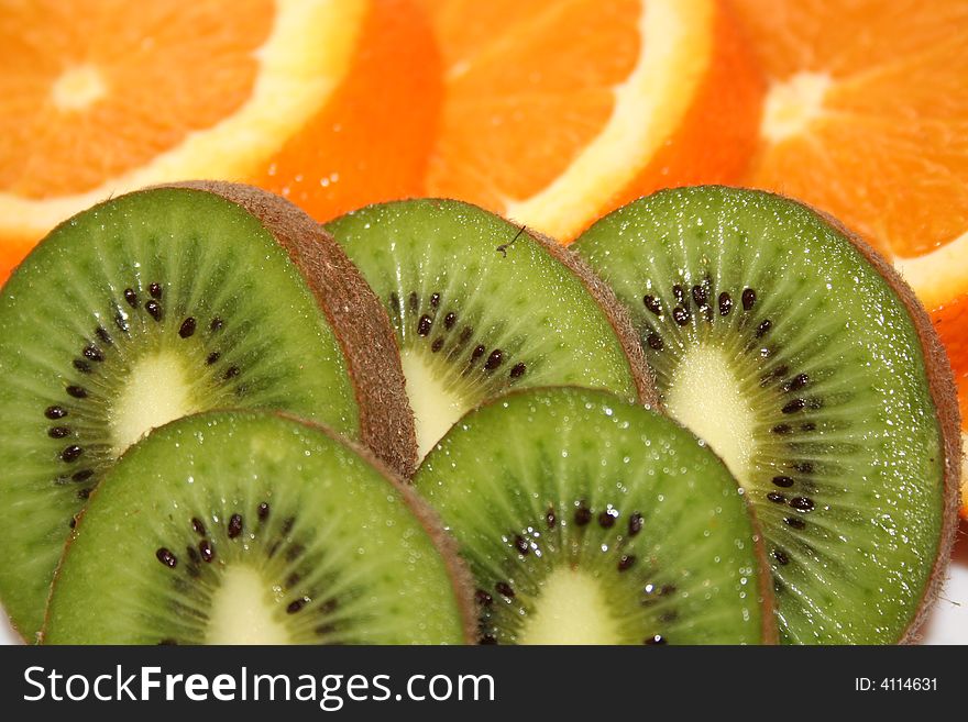 A couple of oranges and kiwis. A couple of oranges and kiwis.