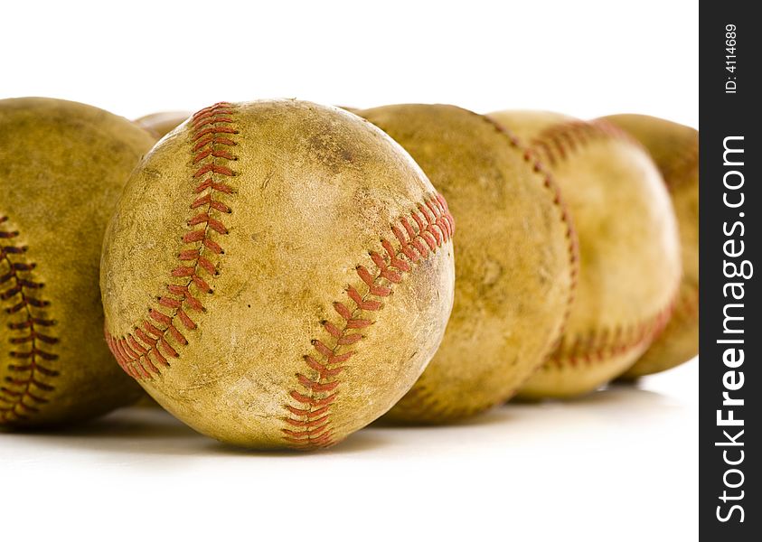 A background of vintage, antique, old baseballs on a white background with copy space. A background of vintage, antique, old baseballs on a white background with copy space