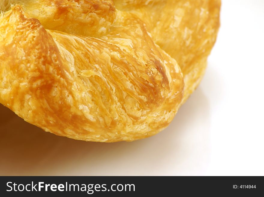 Extreme close up of Butter Croissant pastry on white background. Extreme close up of Butter Croissant pastry on white background.