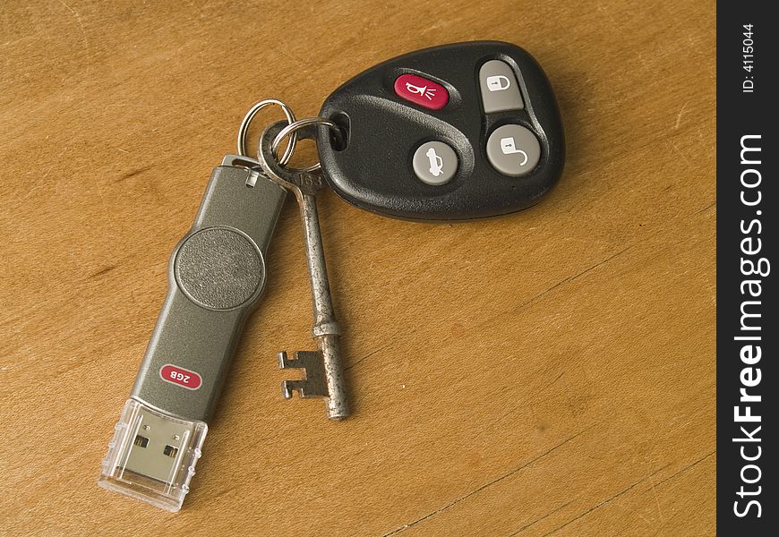 Keychain demonstrating old and new technology with skeleton key,thumb drive and car starter/door opener. Keychain demonstrating old and new technology with skeleton key,thumb drive and car starter/door opener