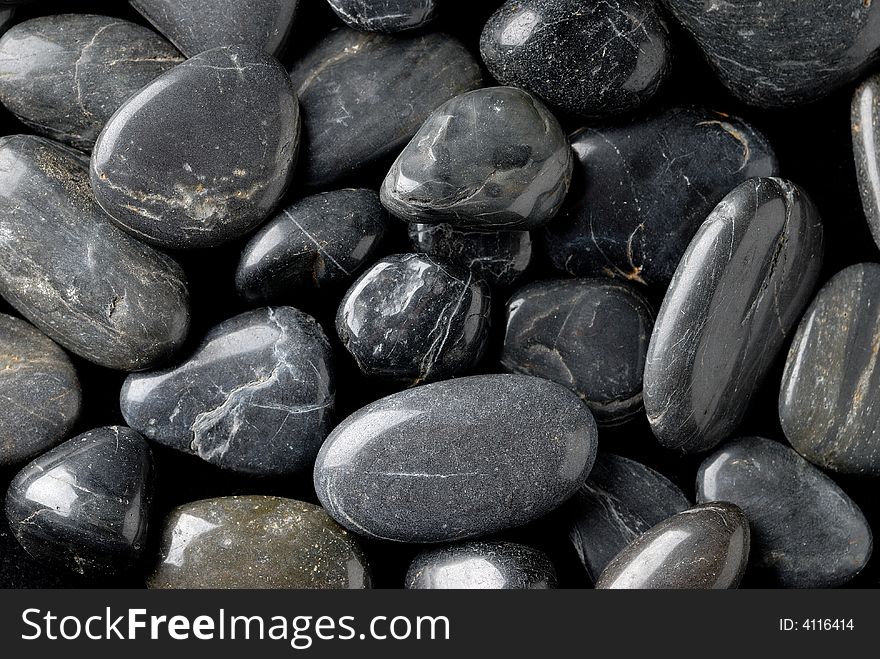 Close up photography of black and grey pebbles