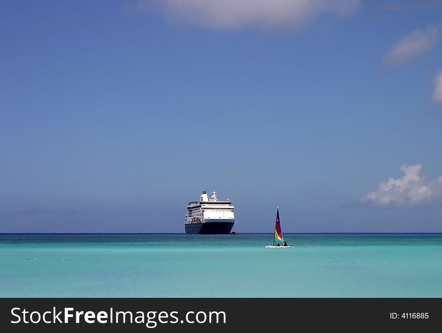 Cruise ship in the Caribbean on a beautiful sunny day. Cruise ship in the Caribbean on a beautiful sunny day.