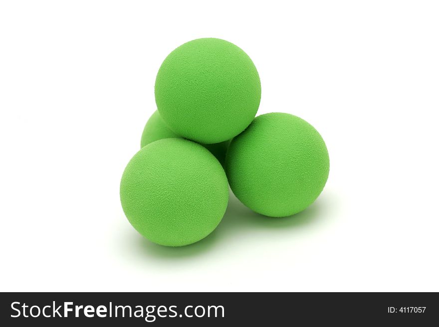 Isolated shot of four green balls. Isolated shot of four green balls.