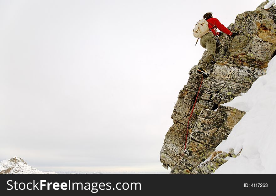 Old style rock climber; winter season, horizontal orientation; italian alps
