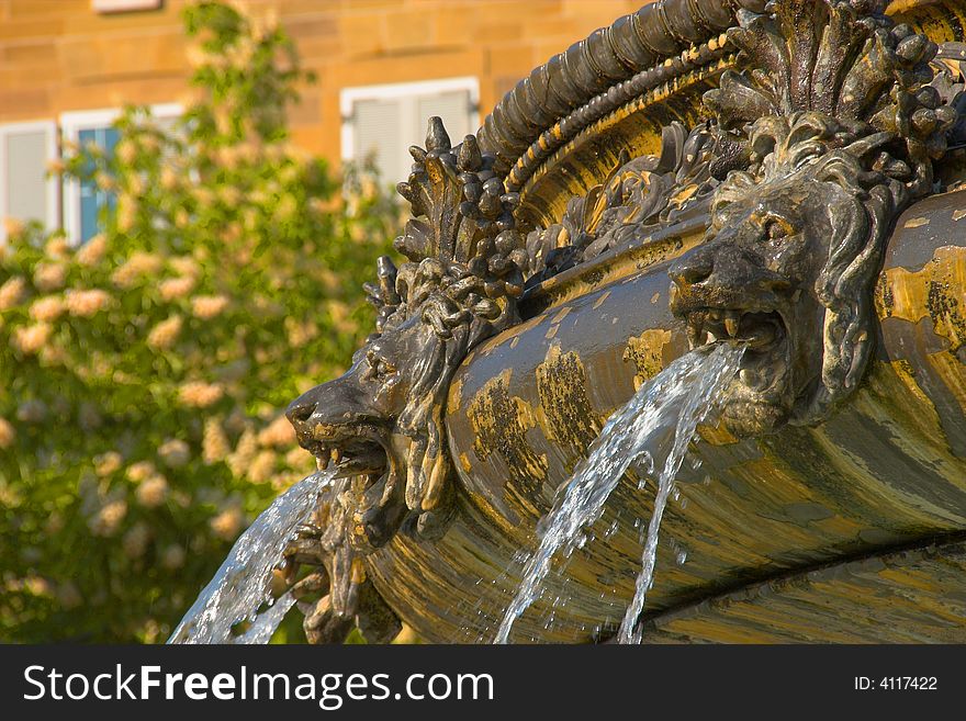 Two Lion heads on a fountain. Two Lion heads on a fountain.